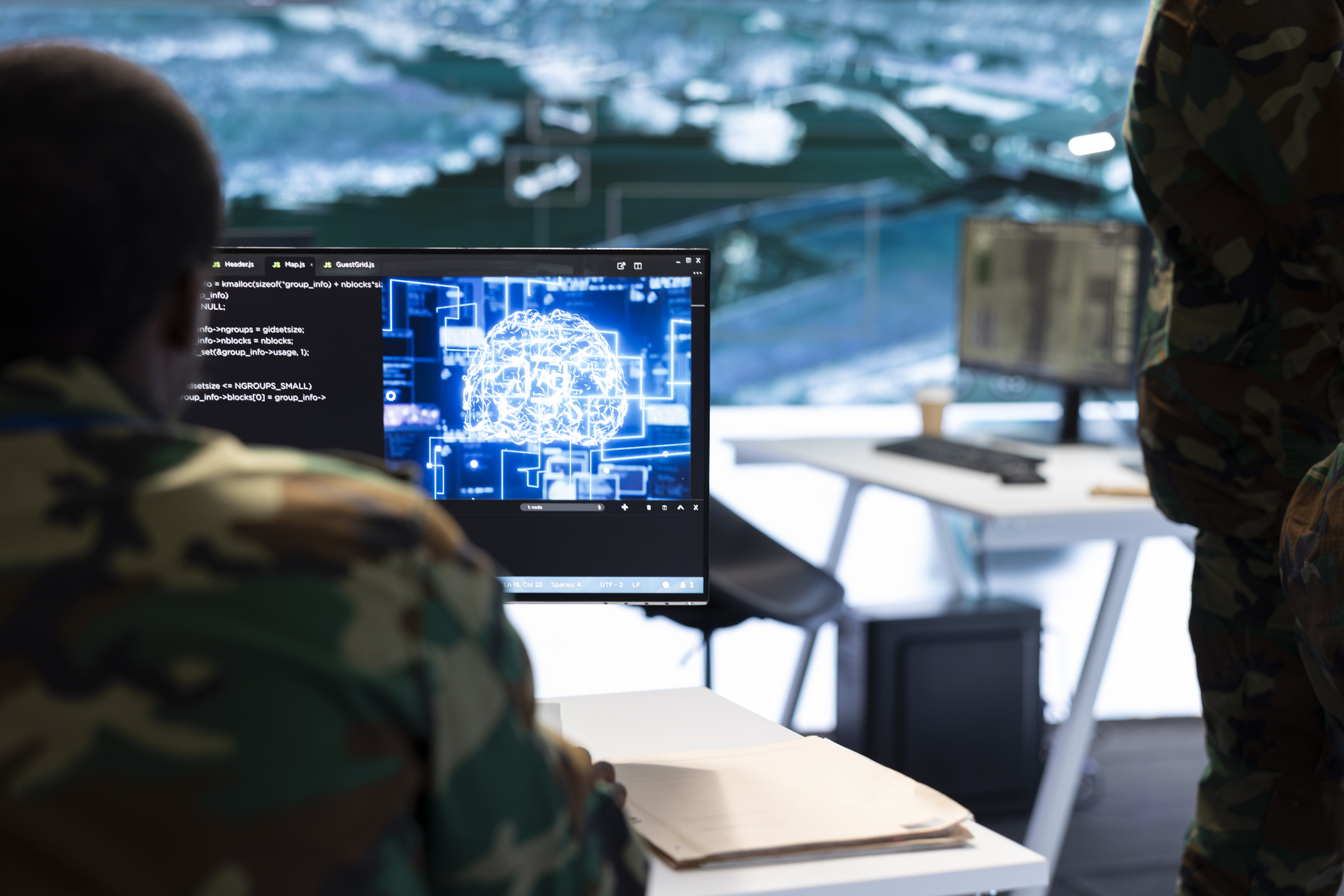 IT expert monitors AI brain intelligence system to collect crucial real time data for a new defense military operation on pc in command post. Security protocols for an intense mission.