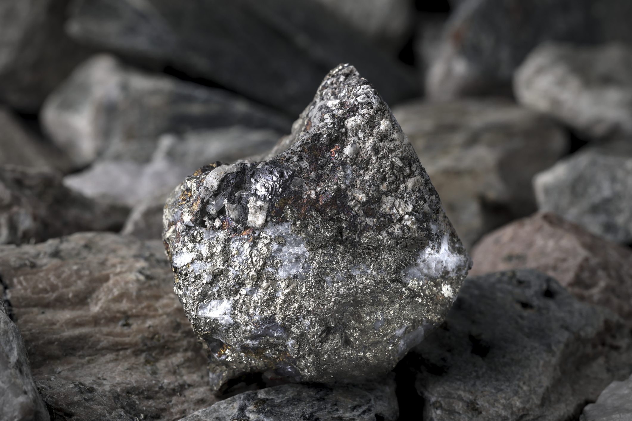 Polymetallic ore. Contain Copper (Cu) lead (Pb), zinc (Zn), nickel (Ni), cobalt (Co). Textured rock background. Mining of critical strategic minerals, raw materials